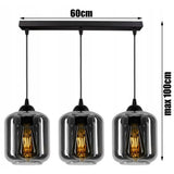 Industriële hanglamp zwart rookglas boven eettafel
